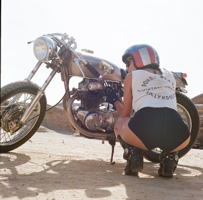 A playful frame from Girls on a motorcycle — online in Sao Paulo